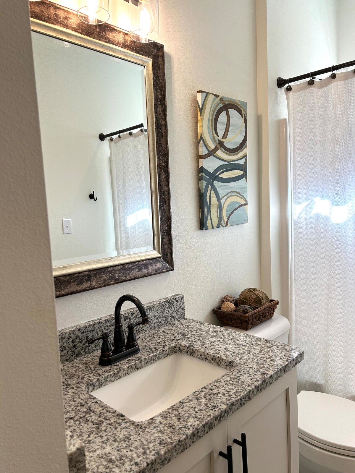 Clean guest bathroom with shower at Auer House Pensacola vacation rental