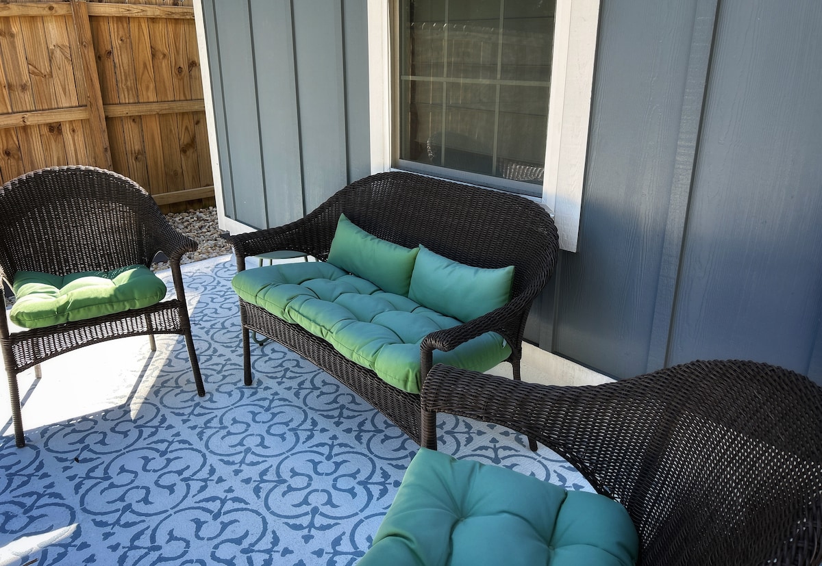 Front porch of Auer House with seating and Blue Angels viewing vantage point