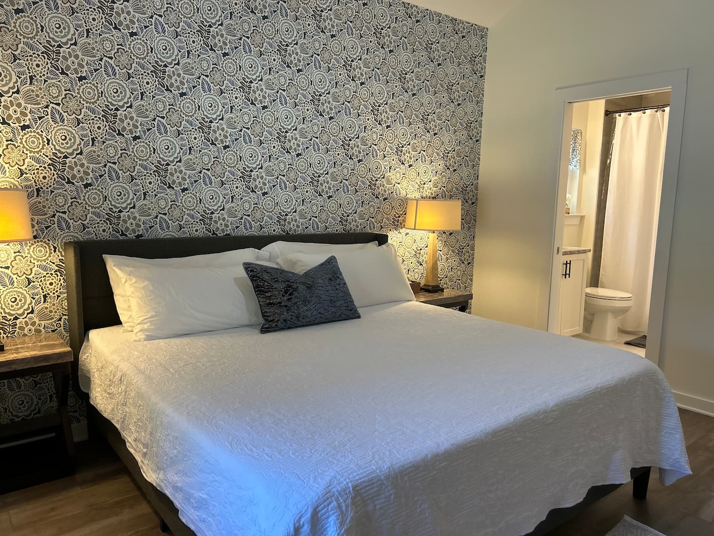 Primary suite with king bed and memory foam mattress at Auer House vacation rental